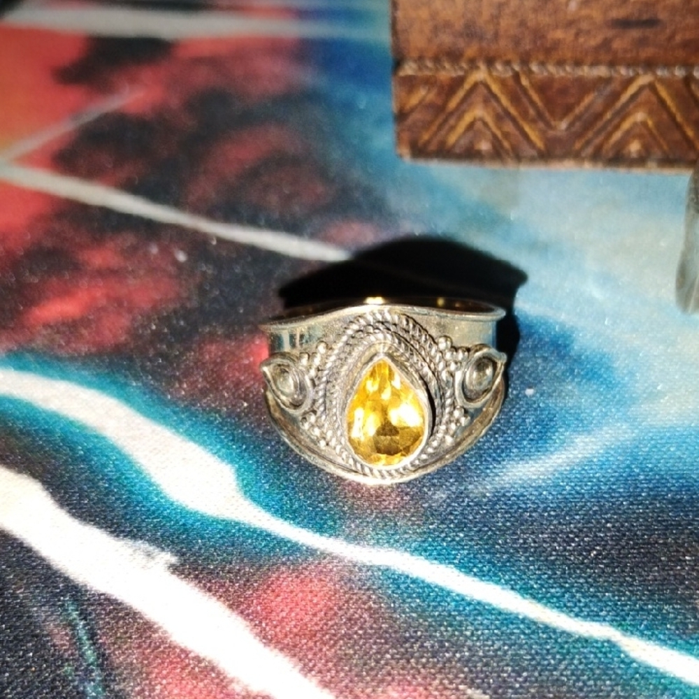 Intricate Silver Ring with Yellow Teardrop Gem